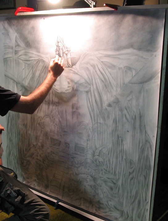 Nathan working on a large, detailed drawing